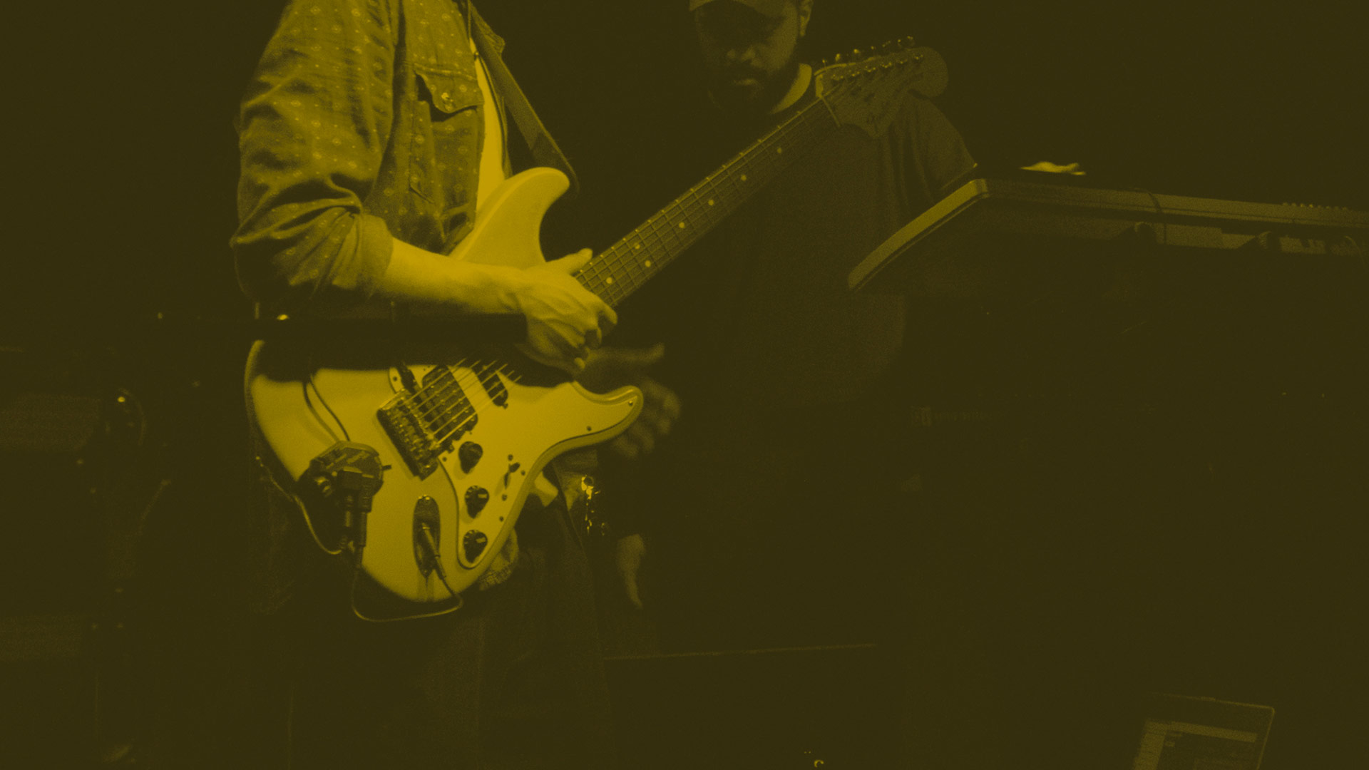 Close-up of guitarist on stage in Australia